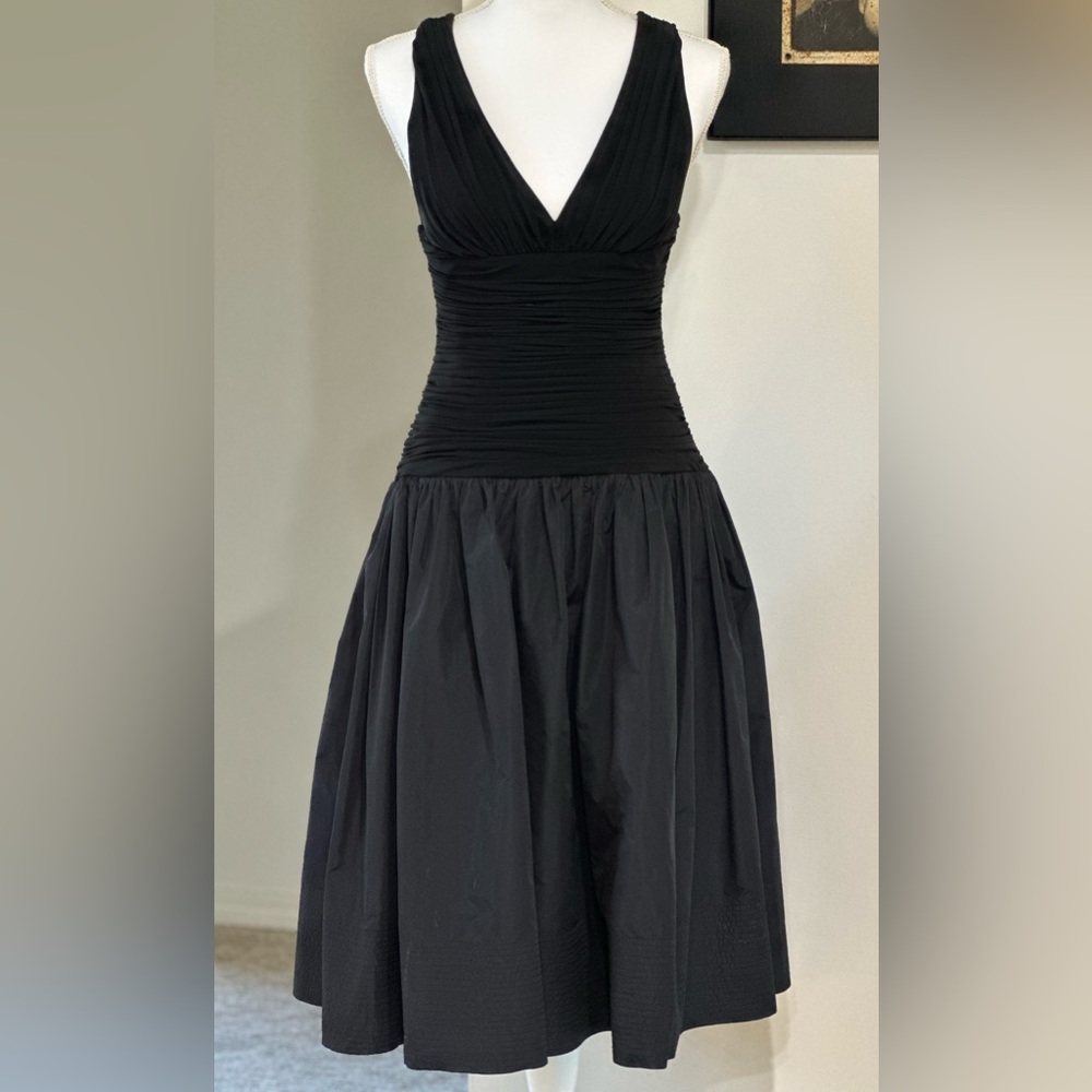 BCBG Max Azria black halter dress. Flattering bust, ruched waist, fun pleats